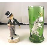 A Continental green glass beaker, decorated a goat, 16cm high and a Karlsbad figure of a young boy