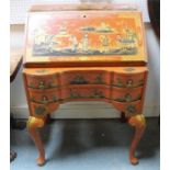 A chinoiserie bureau, the fall flap enclosing compartments and four short drawers above 2 long