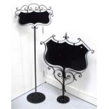 Two black painted wrought iron signs (unwritten)