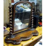 A Victorian mahogany toilet mirror with barley twist supports, 80cm wide.
