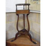 A 19th century mahogany wash stand, with single short drawer above carved supports on carved paw