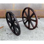 A pair of spoked cast wheels 51cm diameter