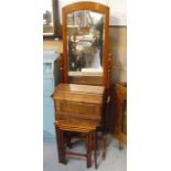 A walnut cheval mirror, a nest of mahogany tables, and a cased sewing machine