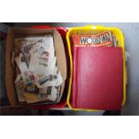 A Stanley Gibbons simplex junior stamp album, a large quantity of loose stamps, Cassells "History of
