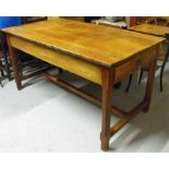 A cherry wood farmhouse kitchen table, with two drawers, on square chamfered legs joined by a