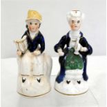 A pair of early 18th century hollow base figures, probably candle snuffers, 11cm high.
