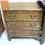 A 20th century George III style mahogany bachelors chest, the brushing slide above 3 graduated