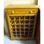 A pine wine-rack, with single frieze drawer - 59cm wide