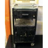 A 1950s metal medical trolley with single drawer and cupboard beneath 52cm wide