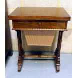 An early 19th century rosewood sewing table, the fold over top above a single drawer, on turned