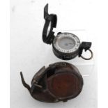 A WWII T.G. & CO MK III marching compass, in leather case, dated 1939.