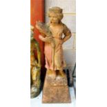 A terracotta garden figure of a young girl holding a wheat sheath,100cm high.