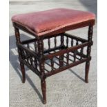 An Edwardian piano stool with ring turned legs 44cm wide