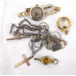 A 9ct gold wrist watch, a 9ct gold crucifix, a 9ct gold "T" bar and other items