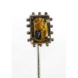A Victorian 9 carat gold and enamel stick pin, decorated with a royal crest, 6.5cm high