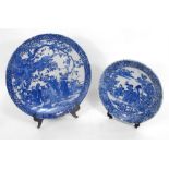 A Japanese blue and white charger, decorated figures 31cm diameter and another similar 25cm diameter