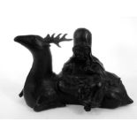 A Chinese bronze group depicting Shoulau sat on a deer (AF), 20 cm wide