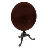An early 19th century mahogany snap top table on turned column with tripod base 75cm diameter