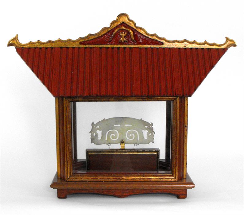 A pierced jade/jadite plaque mounted in a shrine form display case