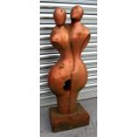 A cast iron abstract sculpture, depicting two figures with coppered finish 76cm high