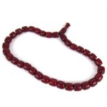 A set of cherry amber coloured worry beads 193g