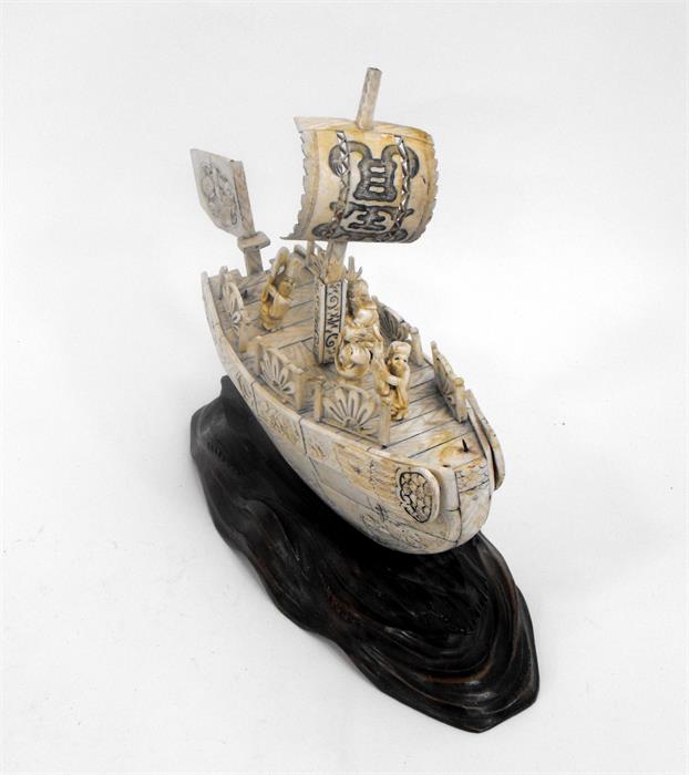 An early 20thC Japanese bone boat with five figures on a carved wooden base (some losses) 24cm x - Image 3 of 4