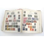 The Strand stamp album and a quantity of loose stamps