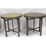 A pair of circular brass tables on folding barley twist legs 61cm diameter