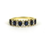 A gold sapphire and diamond ring