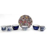 A group of 18thC Chinese blue and white tea bowls, a pair of enamel bowls, and a Canton plate (7) (