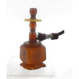 An amber coloured miniature hookah 11.5cm high