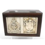 A mahogany table top cigarette box with inset ivorine panel having Royal Amy Medical Corps crest
