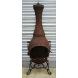 A cast iron garden chiminea 150cm high