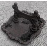 A Victorian cast iron boot scraper 37cm x 30cm