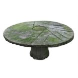 A circular stone garden table 115cm diameter