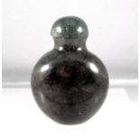 A 19th century Chinese mottled green jade snuff bottle, 5.5cm high.
