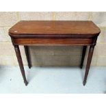 A 19th century mahogany card table on ring turned legs (AF) 92cm wide