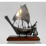 A White metal boat on stand 13cm high