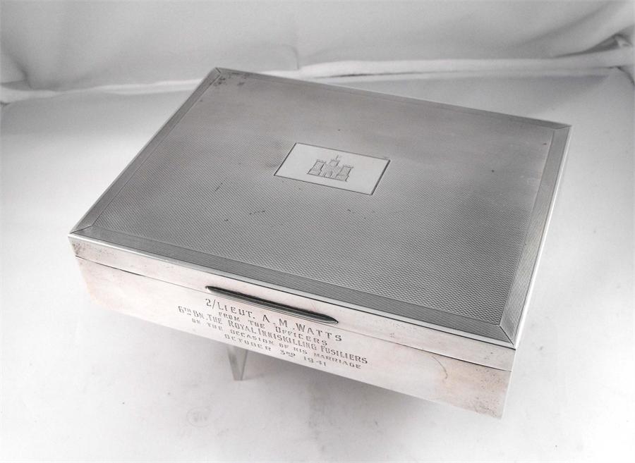 A silver table cigarette box, Birmingham 1940, with military inscription, "2nd Lieut. A. M. Watts
