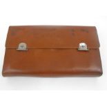 An Asprey leather cased silver mounted gentleman's travelling dressing set, initialed JRH London