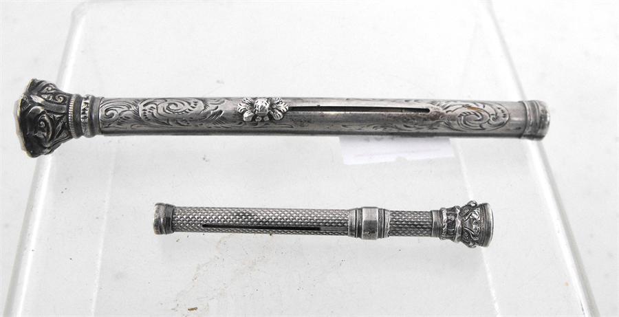 A Victorian white metal combination dip pen and pencil 10cm and a white metal tooth pick 5.5cm (2)