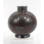 A Richard Ginori bulbous vase with grape and vine silver overlay decoration on a deep red ground,