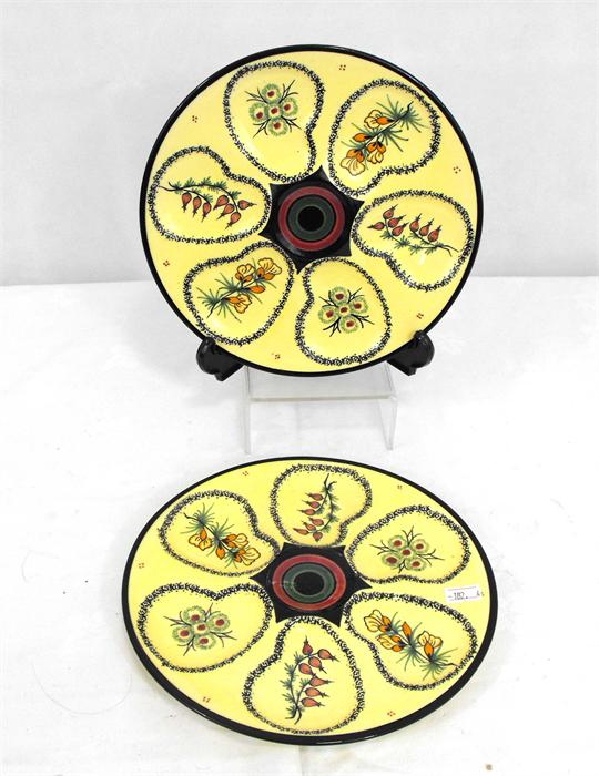 A pair of Henriot Quimper oyster plates decorated with flowers on pale yellow ground, 22cm