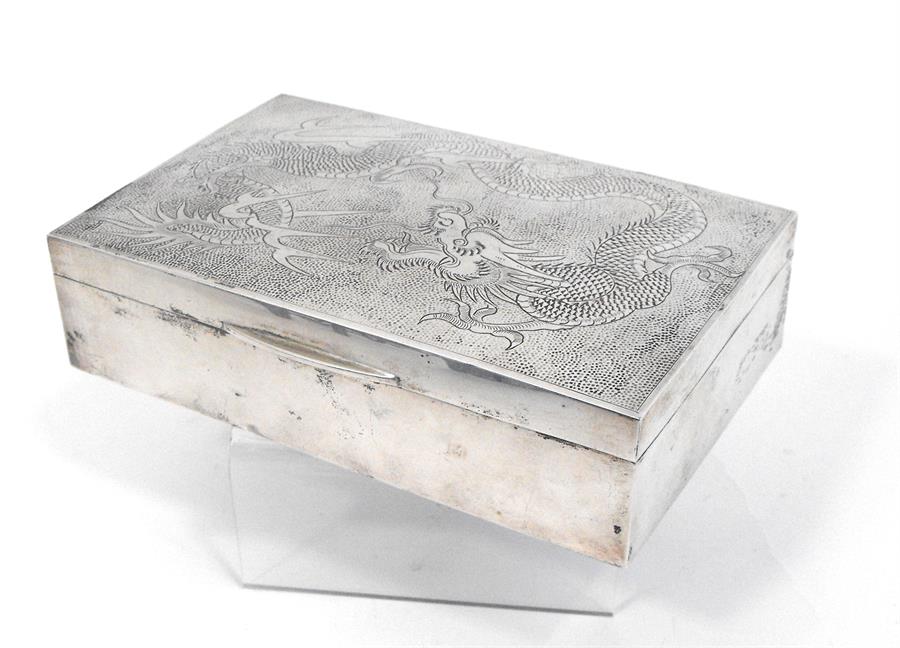 A Chinese silver table cigarette box, decorated with a dragon 17cm x 11cm