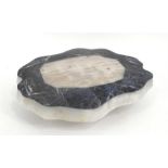 A shaped marble and lapis plinth 36cm x 27cm