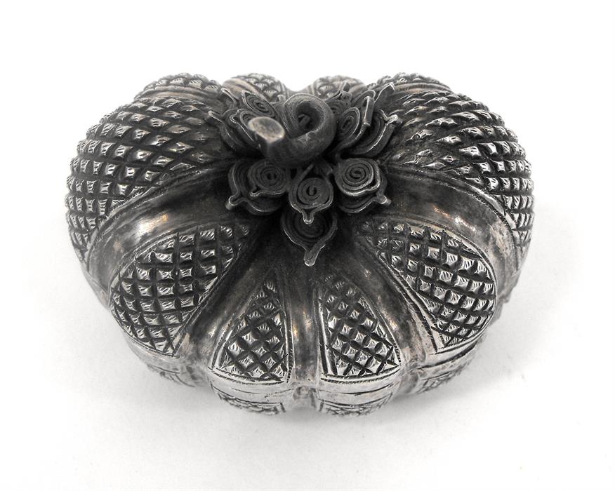 A silver betel nut box, in the form of a pumpkin 7cm x 6cm high