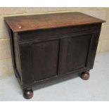 An oak blanket box, standing on four large bun feet 84cm wide