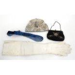 A pair of ladies kid gloves and various evening purses.