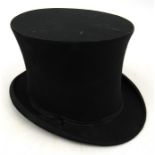 An early 20th century collapsible top hat.