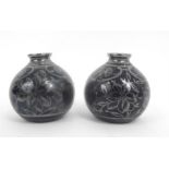 A pair of Richard Ginori bulbous vases with foliate silver overlay decoration on a deep blue